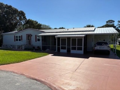 Come and take a look at this large triple-wide manufactured home on Country Club of Mount Dora in Florida - for sale on GolfHomes.com, golf home, golf lot