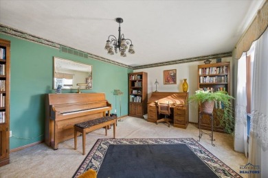 Charming home in the heart of Spearfish! Located just blocks on Spearfish Canyon Country Club in South Dakota - for sale on GolfHomes.com, golf home, golf lot