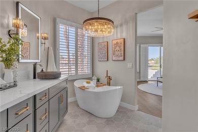 The windows open wide to the sun and the long, green stretch of on Canyon Gate Country Club in Nevada - for sale on GolfHomes.com, golf home, golf lot