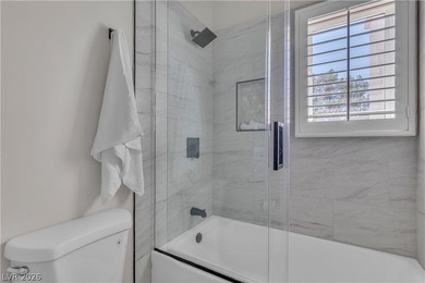 The windows open wide to the sun and the long, green stretch of on Canyon Gate Country Club in Nevada - for sale on GolfHomes.com, golf home, golf lot