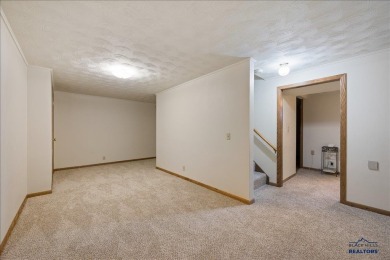 Charming home in the heart of Spearfish! Located just blocks on Spearfish Canyon Country Club in South Dakota - for sale on GolfHomes.com, golf home, golf lot