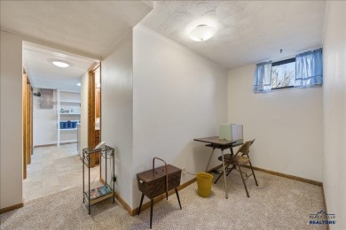 Charming home in the heart of Spearfish! Located just blocks on Spearfish Canyon Country Club in South Dakota - for sale on GolfHomes.com, golf home, golf lot
