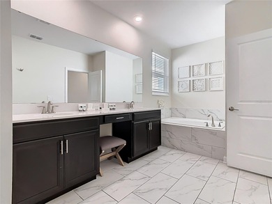 A turn-key, fully furnished ChampionsGate escape offering the on National Golf Course in Florida - for sale on GolfHomes.com, golf home, golf lot