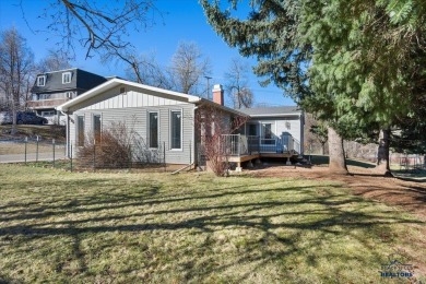 Charming home in the heart of Spearfish! Located just blocks on Spearfish Canyon Country Club in South Dakota - for sale on GolfHomes.com, golf home, golf lot