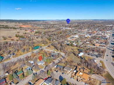 Charming home in the heart of Spearfish! Located just blocks on Spearfish Canyon Country Club in South Dakota - for sale on GolfHomes.com, golf home, golf lot