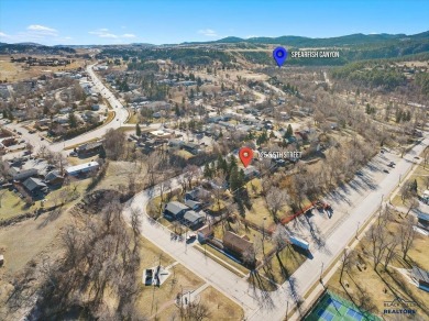 Charming home in the heart of Spearfish! Located just blocks on Spearfish Canyon Country Club in South Dakota - for sale on GolfHomes.com, golf home, golf lot