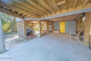 Sitting well elevated in an X flood zone, Sunny Days is located on The Currituck Golf Club in North Carolina - for sale on GolfHomes.com, golf home, golf lot