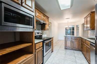 Tucked into a prime corner lot inside the gated paradise of on Pecan Plantation Country Club in Texas - for sale on GolfHomes.com, golf home, golf lot