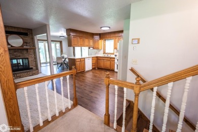 CAPTIVATING RESIDENCE ON 3 SPACIOUS LOTS--A NATURE LOVER'S on Rice Lake Golf and Country Club in Iowa - for sale on GolfHomes.com, golf home, golf lot