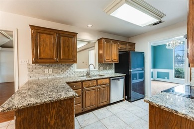 Tucked into a prime corner lot inside the gated paradise of on Pecan Plantation Country Club in Texas - for sale on GolfHomes.com, golf home, golf lot