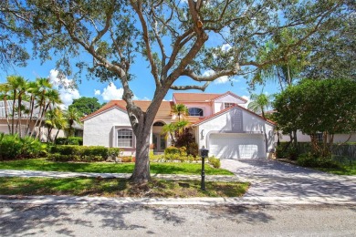 Elegant two-story home located in the prestigious Weston Hills on Weston Hills Country Club in Florida - for sale on GolfHomes.com, golf home, golf lot