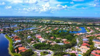 Elegant two-story home located in the prestigious Weston Hills on Weston Hills Country Club in Florida - for sale on GolfHomes.com, golf home, golf lot