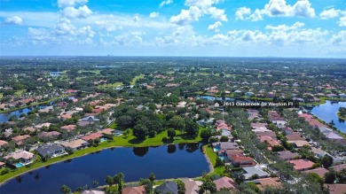 Elegant two-story home located in the prestigious Weston Hills on Weston Hills Country Club in Florida - for sale on GolfHomes.com, golf home, golf lot