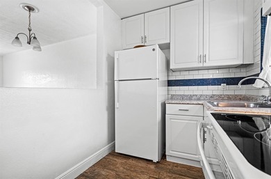 Move-in ready 1/1 condo on golf course in 55+ community. Kitchen on Leisureville Community Association in Florida - for sale on GolfHomes.com, golf home, golf lot