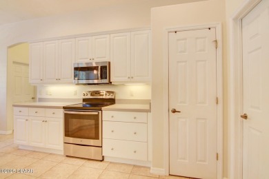 Located on a quiet dead-end street in the guard-gated Spruce on Spruce Creek Golf Club in Florida - for sale on GolfHomes.com, golf home, golf lot