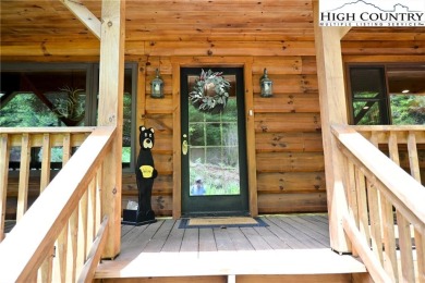 Custom built Rustic Log Home on a quiet wooded lot.  Enjoy this on Mountain Aire Golf Course in North Carolina - for sale on GolfHomes.com, golf home, golf lot