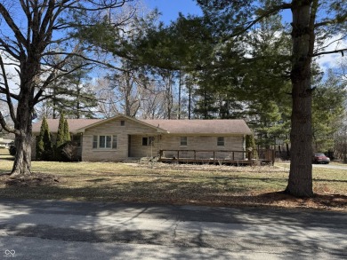 A MUST-SEE all stone ranch located in established Carmel on Woodland Country Club in Indiana - for sale on GolfHomes.com, golf home, golf lot