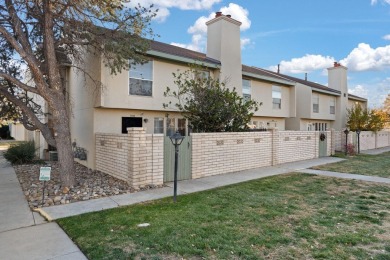 This beautifully maintained townhome offers a perfect blend of on Arroyo Del Oso Golf Course in New Mexico - for sale on GolfHomes.com, golf home, golf lot