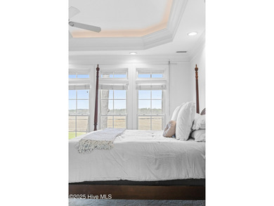 Where the Shallotte River bends and the 17th hole sweeps along on Rivers Edge Golf Club in North Carolina - for sale on GolfHomes.com, golf home, golf lot