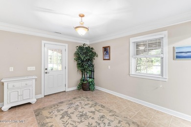 Where the Shallotte River bends and the 17th hole sweeps along on Rivers Edge Golf Club in North Carolina - for sale on GolfHomes.com, golf home, golf lot