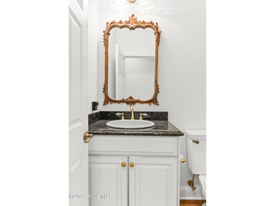 Where the Shallotte River bends and the 17th hole sweeps along on Rivers Edge Golf Club in North Carolina - for sale on GolfHomes.com, golf home, golf lot