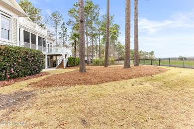 Where the Shallotte River bends and the 17th hole sweeps along on Rivers Edge Golf Club in North Carolina - for sale on GolfHomes.com, golf home, golf lot