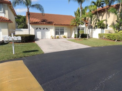 Discover your dream home in the desirable Doral Glen community on Jim McLean Signature Course in Florida - for sale on GolfHomes.com, golf home, golf lot