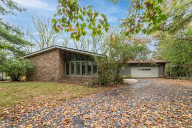 Experience the perfect blend of timeless design and modern on Ann Arbor Country Club in Michigan - for sale on GolfHomes.com, golf home, golf lot