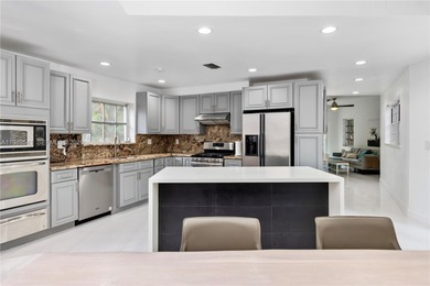 This stunning two-story, corner-lot home offers an unbeatable on Granada Golf Club in Florida - for sale on GolfHomes.com, golf home, golf lot