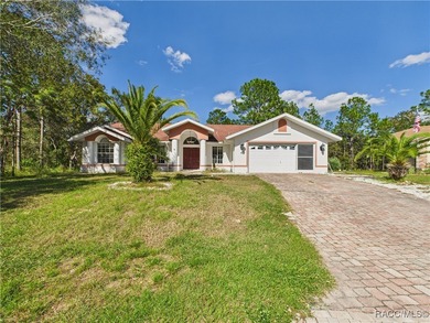 Charming 3-bedroom, 2-bathroom pool home nestled in the serene on Sugarmill Woods Golf and Country Club in Florida - for sale on GolfHomes.com, golf home, golf lot