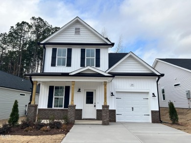 This gorgeous residence highlights classic comforts including a on Riverwood Golf and Athletic Club in North Carolina - for sale on GolfHomes.com, golf home, golf lot