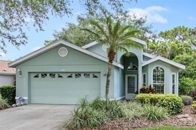 Discover tranquil living with a water view in Pinehurst Village! on Palm Aire Country Club of Sarasota in Florida - for sale on GolfHomes.com, golf home, golf lot