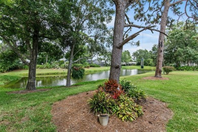 Discover tranquil living with a water view in Pinehurst Village! on Palm Aire Country Club of Sarasota in Florida - for sale on GolfHomes.com, golf home, golf lot