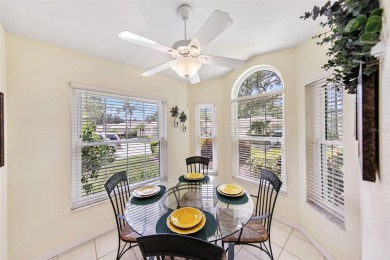 Discover tranquil living with a water view in Pinehurst Village! on Palm Aire Country Club of Sarasota in Florida - for sale on GolfHomes.com, golf home, golf lot