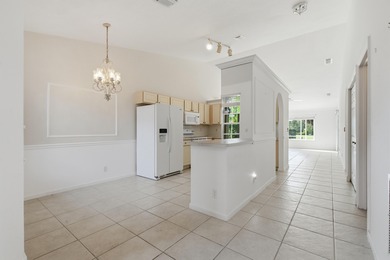 Welcome to easy, low-maintenance living in Guard-gated Jensen on Eagle Marsh Golf Club in Florida - for sale on GolfHomes.com, golf home, golf lot