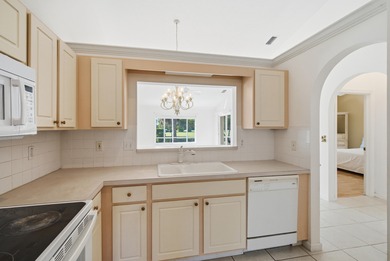 Welcome to easy, low-maintenance living in Guard-gated Jensen on Eagle Marsh Golf Club in Florida - for sale on GolfHomes.com, golf home, golf lot