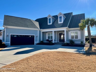 This exceptional residence is located within The Lakes at on Cape Fear National At Brunswick Forest in North Carolina - for sale on GolfHomes.com, golf home, golf lot