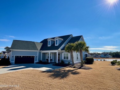 This exceptional residence is located within The Lakes at on Cape Fear National At Brunswick Forest in North Carolina - for sale on GolfHomes.com, golf home, golf lot