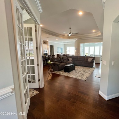 This exceptional residence is located within The Lakes at on Cape Fear National At Brunswick Forest in North Carolina - for sale on GolfHomes.com, golf home, golf lot