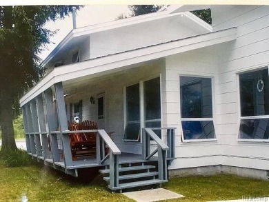 This home is in a private community owned by residents of the on Lost Lake Woods Club in Michigan - for sale on GolfHomes.com, golf home, golf lot