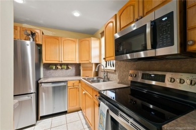 Welcome to your slice of paradise at MYCC. This charming 2 BR/2 on Monterey Yacht and Country Club in Florida - for sale on GolfHomes.com, golf home, golf lot
