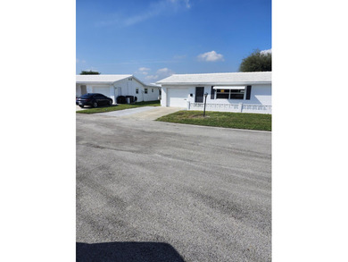 Single family home in Boynton's premier 55+ communitypletely on Leisureville Community Golf Course in Florida - for sale on GolfHomes.com, golf home, golf lot