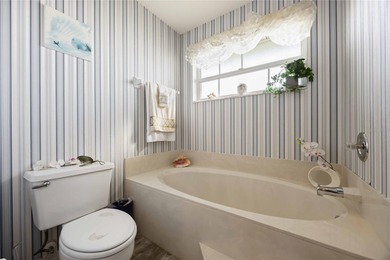 A peaceful waterfront gem wrapped in Florida charm.
Step into on Plantation Golf and Country Club in Florida - for sale on GolfHomes.com, golf home, golf lot