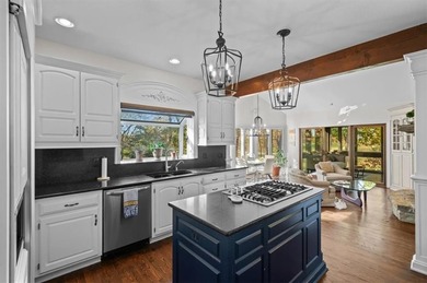 Welcome to 16750 S Village Drive, an elegant 4-bedroom, 2.5-bath on Loch Lloyd Country Club in Missouri - for sale on GolfHomes.com, golf home, golf lot