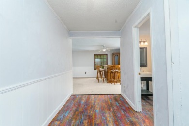 Welcome to 106 Tam O'Shanter Court -- a charming 2-bedroom on Diamondhead Golf and Country Club in Arkansas - for sale on GolfHomes.com, golf home, golf lot