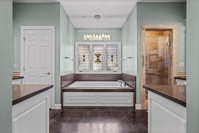 Welcome to 16750 S Village Drive, an elegant 4-bedroom, 2.5-bath on Loch Lloyd Country Club in Missouri - for sale on GolfHomes.com, golf home, golf lot