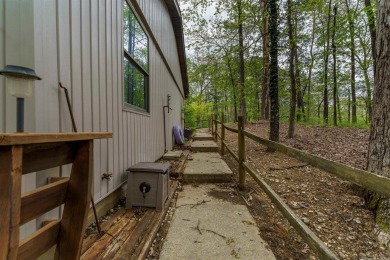 Welcome to 106 Tam O'Shanter Court -- a charming 2-bedroom on Diamondhead Golf and Country Club in Arkansas - for sale on GolfHomes.com, golf home, golf lot