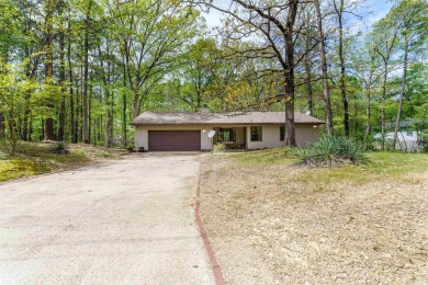 Welcome to 106 Tam O'Shanter Court -- a charming 2-bedroom on Diamondhead Golf and Country Club in Arkansas - for sale on GolfHomes.com, golf home, golf lot