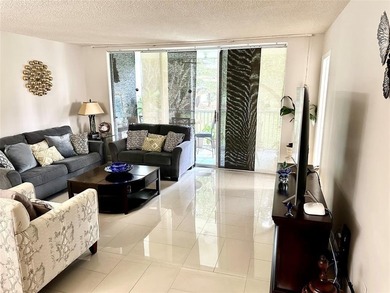 Welcome to this bright and spacious second-floor 3-bedroom on Palm-Aire Country Club and Resort - Palms in Florida - for sale on GolfHomes.com, golf home, golf lot