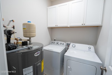 Built in 2024, this beautifully designed home offers the perfect on The Lakes Country Club in North Carolina - for sale on GolfHomes.com, golf home, golf lot